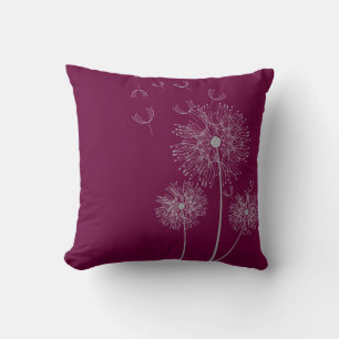 Dandelion flower on purple cushion