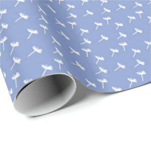 Dandelion Seeds Floating on Blue Wrapping Paper