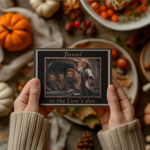 Daniel standing in the lions den ancient-looking  postcard