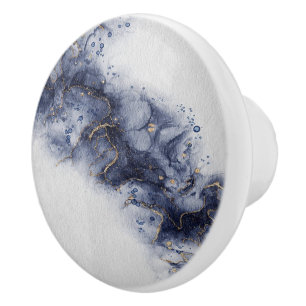 Dark blue and gold watercolor ink marks ceramic knob