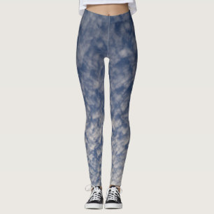 Dark blue leggings featuring a cloudy sky