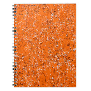 Dark brown grunge background. Black white orange o Notebook