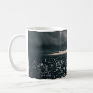 DARK CLOUD ABOVE CITY BUILDINGS COFFEE MUG