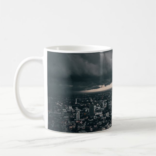 DARK CLOUD ABOVE CITY BUILDINGS COFFEE MUG (Left)
