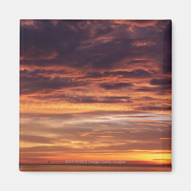 Dark clouds in orange streaked sky magnet (Front)