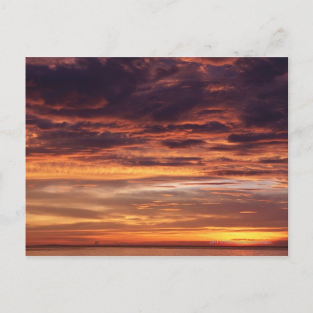 Dark clouds in orange streaked sky postcard (Front)