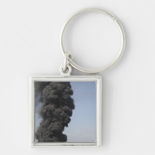 Dark clouds of smoke and fire emerge key ring