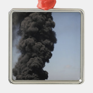 Dark clouds of smoke and fire emerge metal tree decoration