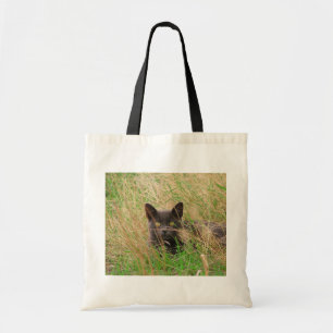 Dark Grey Cat Peeking out from Tall Grass Tote Bag
