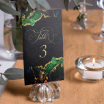 Dark Moody Emerald Bronze Abstract Table Number<br><div class="desc">A modern ink washed wedding table number with emerald green and liquid gold and bronze on a black background. This elegant wedding table number card features an artistic wash of colorful inks in emerald green and golden bronze. Easily edit the template using Zazzle's customization tool. Please contact us if you...</div>