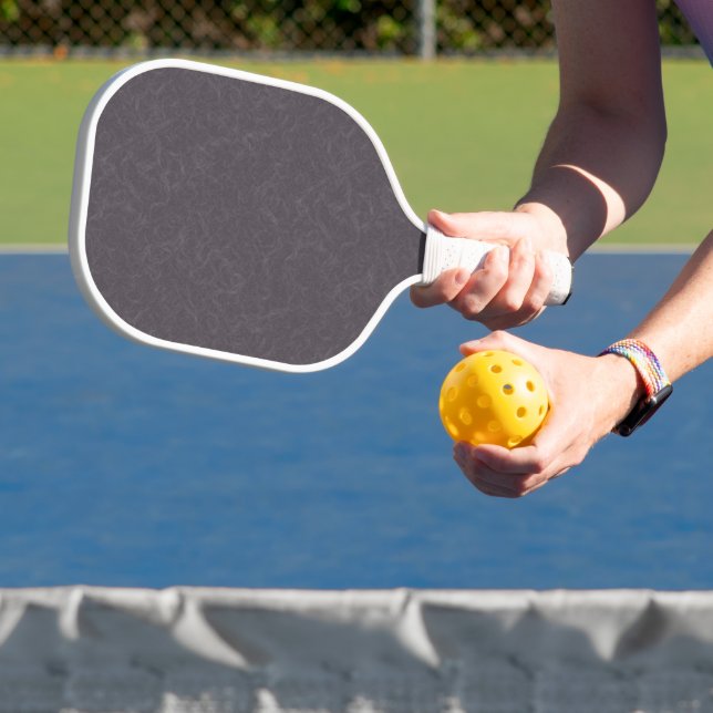 Dark purple textured surface swirling pattern pickleball paddle (Insitu)