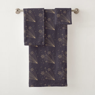 Dark purple towels and a washcloth feature