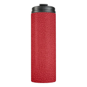 Dark red artificial leatherette closeup. thermal tumbler