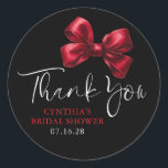 Dark Red Bow Favours Black Bridal Shower Thank You Classic Round Sticker<br><div class="desc">Add a Touch of Charm with These Elegant Red Bow Thank You Stickers. Looking to give your party favours and gifts that perfect finishing touch? These red bow thank you stickers are just what you need! Featuring a beautiful watercolor bow paired with graceful, handwritten-style script, and black moody background they...</div>