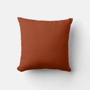 Dark reddish-orange cushion