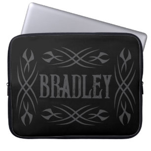 Dark tribal tattoo design on personalised laptop sleeve