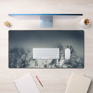 Darkness and clouds covering mountain desk mat