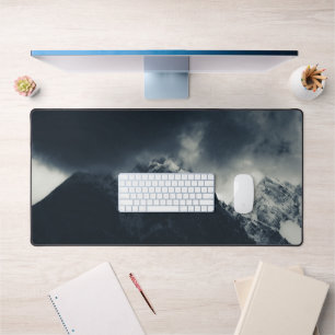 Darkness and storm clouds over mountains desk mat