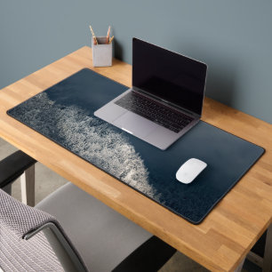 Darkness and sun over snowy spruce forest desk mat