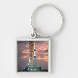 Dawn breaks behind ASTP Saturn IB CDDT Key Ring
