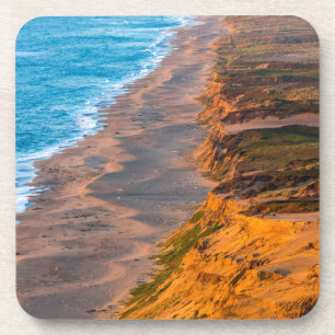 Days Last Light Strikes The Sandy Shore Of Point Coaster