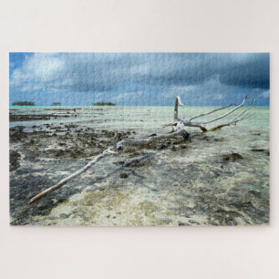 Dead wood in the Pacific under a cloudy sky Jigsaw Puzzle