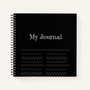 Decorative print on black spiral notebook