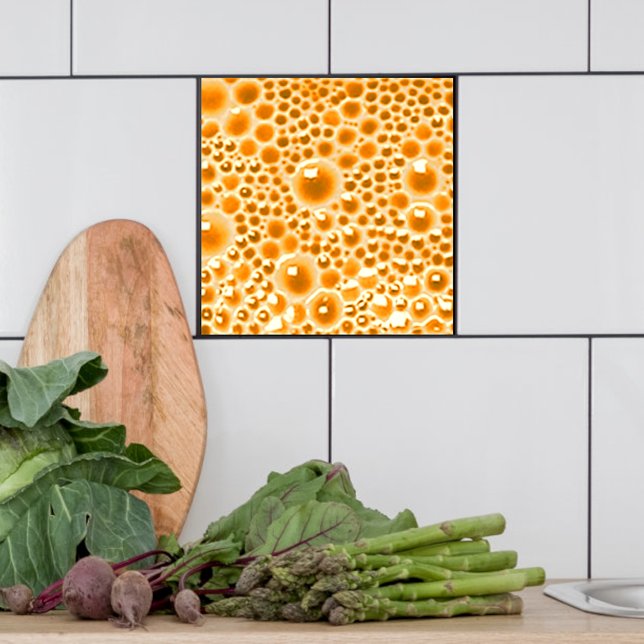 Decorative Tile with bubbles, orange marmalade  (Orange marmalade bubble tile shown  in a kitchen.)