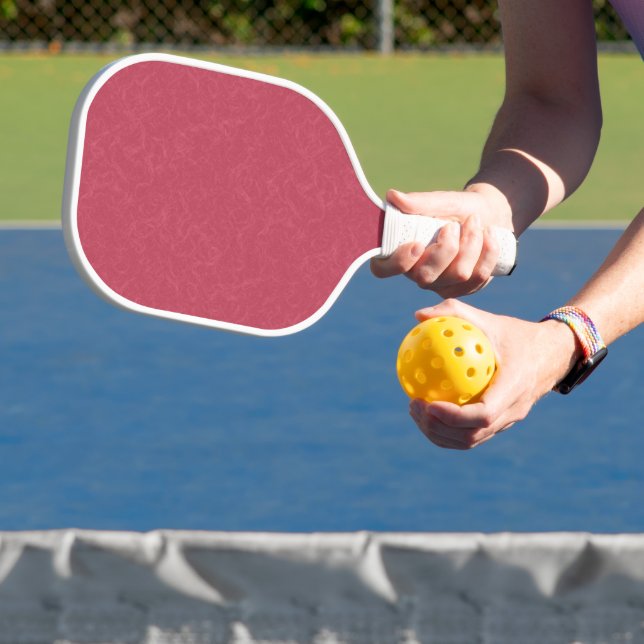 Deep pink  textured swirling  pattern pickleball paddle (Insitu)