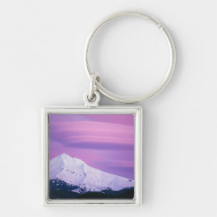 Deep purple clouds surround Mount Hood, in Key Ring
