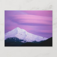 Deep purple clouds surround Mount Hood, in