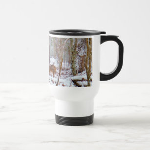 Deer in the snow, licking leg travel mug