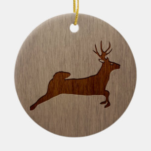 Deer silhouette engraved on wood design ceramic ornament
