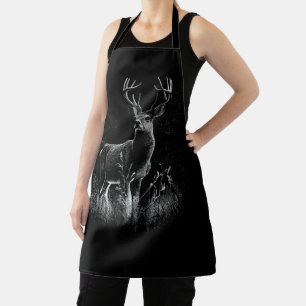 Deer with antlers framed by field and tree       apron