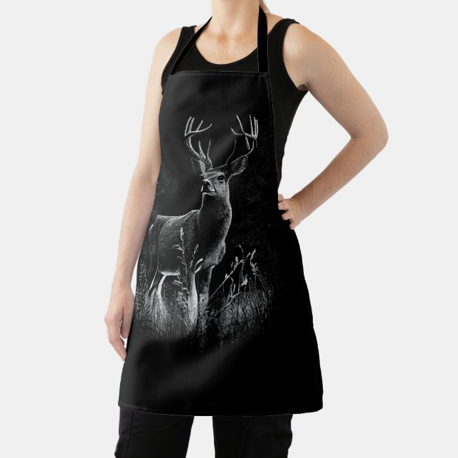 Deer with antlers framed by field and tree       apron (Insitu)