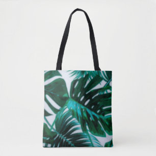 Defocus abstract background of the green plantabst tote bag