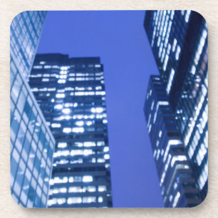 Defocused upward view of office building windows coaster