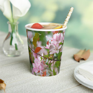 Delicate branch with flowers apple tree paper cups