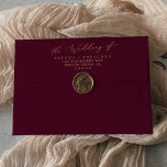 Delicate Gold Burgundy Wedding Invitation Envelope<br><div class="desc">This delicate gold burgundy wedding invitation envelope is perfect for a modern wedding. The romantic minimalist design features lovely and elegant champagne golden yellow typography on a burgundy red background with a clean and simple look. Personalise the envelope flap with your return address.</div>