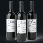 Delicate orchid cheers to the wedding blue custom wine label<br><div class="desc">Elegant customisable wine labels for your wedding reception, featuring beautiful and delicate Prussian blue orchids line drawing on one side, over a classic white background, and the wording "Cheers to the wedding of" in dark blue fonts. Easily edit the template fields to add the bride and groom names in a...</div>