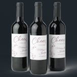 Delicate orchid cheers to wedding purple custom wine label<br><div class="desc">Elegant customisable wine labels for your wedding reception, featuring beautiful and delicate pastel purple orchids line drawing on one side, over a classic white background, and the wording "Cheers to the wedding of" in purple fonts. Easily edit the template fields to add the bride and groom names in a classy...</div>