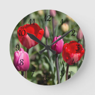 Delicate red and purple tulips round clock