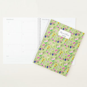 Delicate watercolour wildflowers on green planner