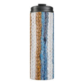 Denim patchwork: recycled jeans rug. thermal tumbler