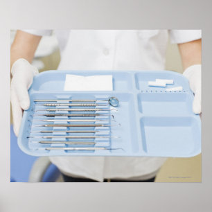 Dental hygienist holding tray of dental poster