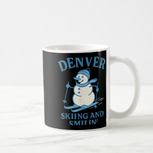 Denver colorado skiing and smilin snowman coffee mug