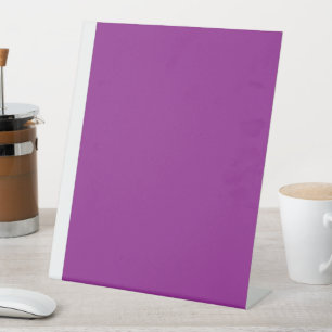 Design with a Stunning Purple Background and White Pedestal Sign