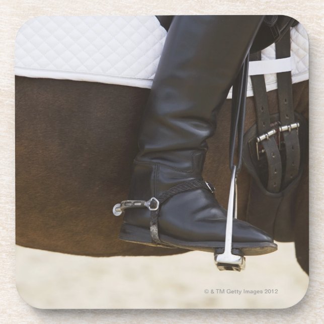 detail of female dressage rider on horse coaster (Front)