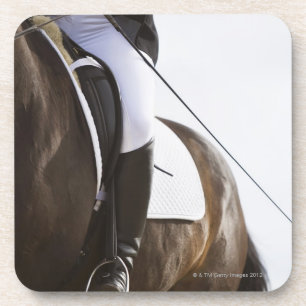 detail of female dressage rider on horse coaster