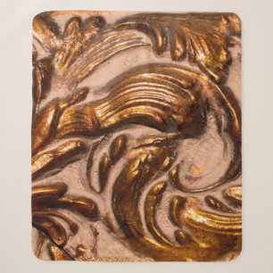 detail of ornamental picture frame, bronze colour. sherpa blanket